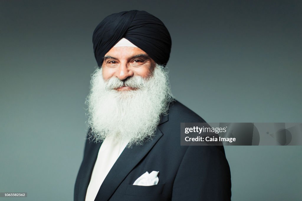 Portrait smiling, confident well-dressed senior man wearing turban