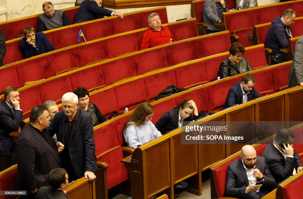 Ukrainian lawmakers seen before a vote for introduce the...