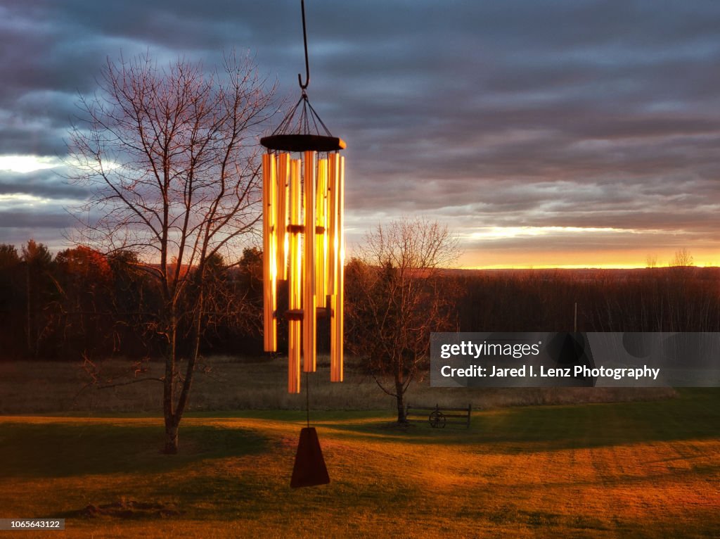 Wind Chimes Glow in the Rising Sun