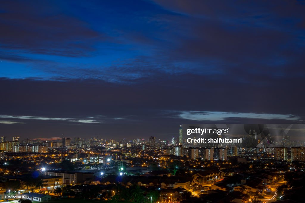 Blue hour over Kuala Lumpur, capital of Malaysia. Its modern skyline is dominated by the 451m tall KLCC, a pair of glass and steel clad skyscrapers.