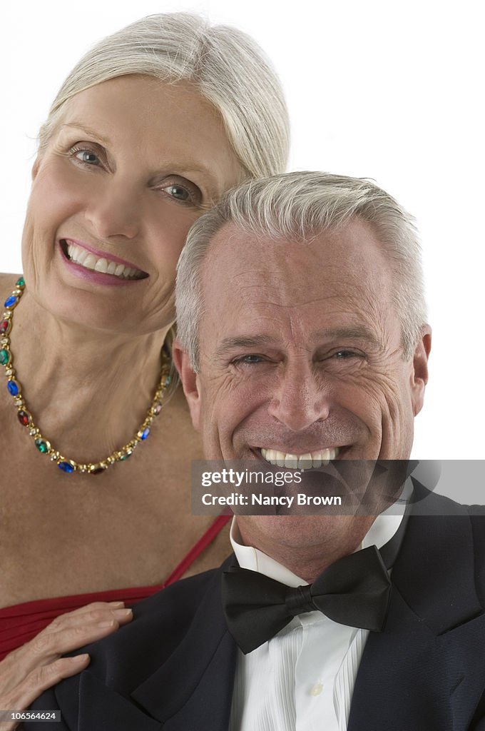 Senior caucasian couple formal head shot.