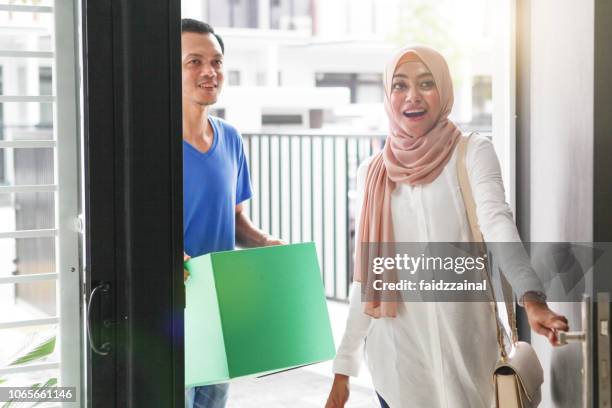 malay muslim couples moving in to a new home - malay lover stock pictures, royalty-free photos & images