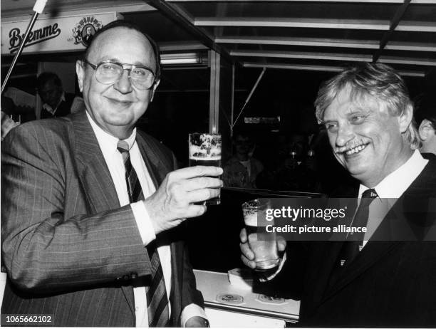 German Foreign Minister Hans-Dietrich Genscher and Czechoslovakian Foreign Minister Jiri Dienstbier drink a beer together in Wuppertal, Germany, 13...