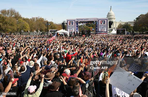 People gather on the National Mall in Washington, DC, on October 30, 2010 for television satirists Jon Stewart's and Stephen Colbert's Rally to...