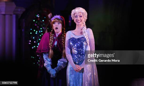 Disney characters of animation movie, Frozen, Anna and Queen Elsa perform 'A Frozen Holiday Wish' during the 'Mickey's Very Merry Christmas Party' at...