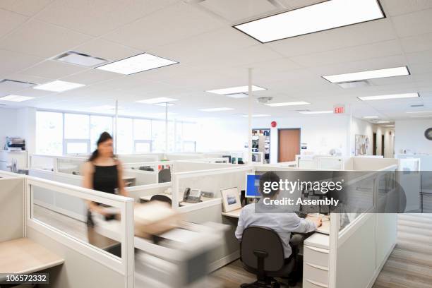 woman pushing mail cart in office - cubicle stock pictures, royalty-free photos & images