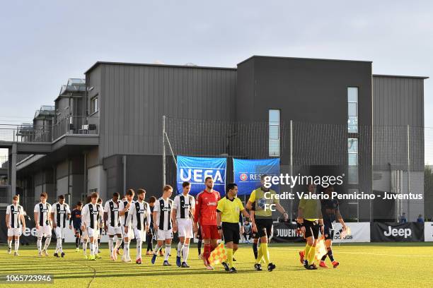 Team of Juventus U19 and team of Valencia U19 enter the field during the UEFA Youth League match between Juventus U19 and Valencia U19 at Juventus...