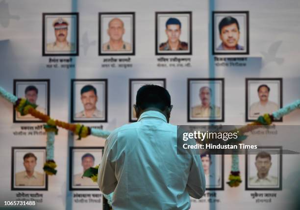 Man salutes the martyrs at the site of the Martyrs Memorial at CSMT on the occasion the 10th anniversary of the terrorist attacks, on November 26,...