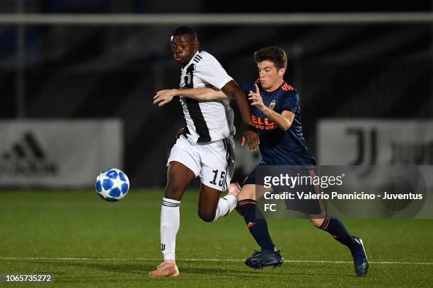 Paolo Gozzi Iweru of Juventus U19 competes for the ball during the UEFA Youth League match between Juventus U19 and Valencia U19 at Juventus Center...