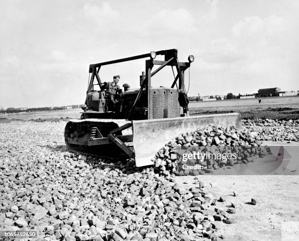 Soldiers build a new cement track at Templehof airfield in the Berlin US-controlled zone, during the Berlin blockade on July 1948.