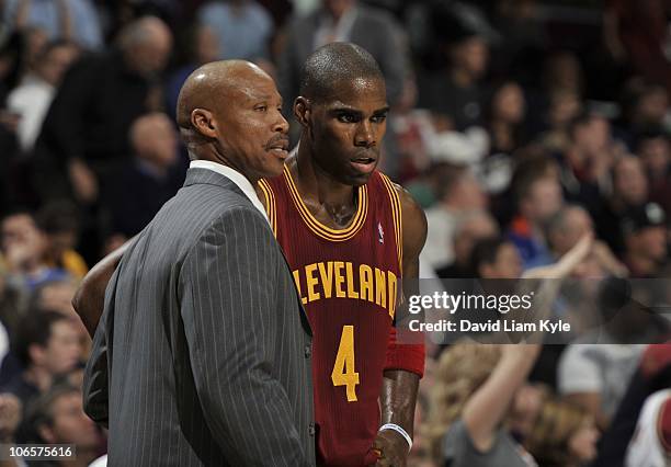 Byron Scott, head coach of the Cleveland Cavaliers, talks with Antawn Jamison against the Boston Celtics at The Quicken Loans Arena on October 27,...