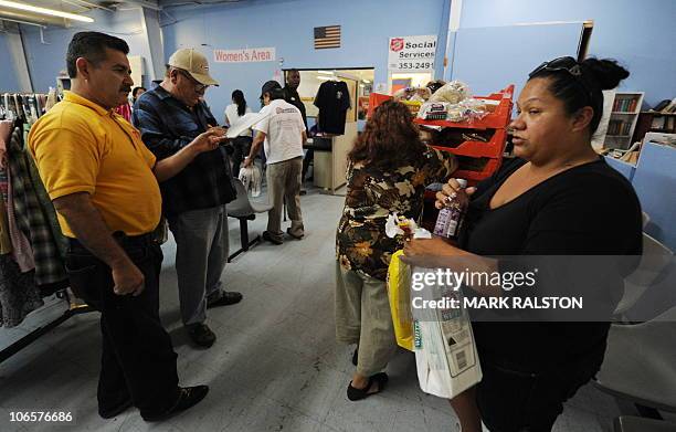 Unemployed people receive bread handouts from The Salvation Army in the southern Californian town of El Centro, a town of 50,000 people where 30.4...