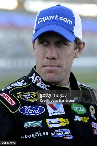 Carl Edwards, driver of the Copart.com Ford, stands on the grid during qualifying for the NASCAR Nationwide Series O'Reilly Auto Parts Challenge at...