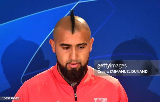 Barcelona's Chilean midfielder Arturo Vidal looks on during a press conference at the Philips stadium in Eindhoven on November 27, 2018 on the eve of...