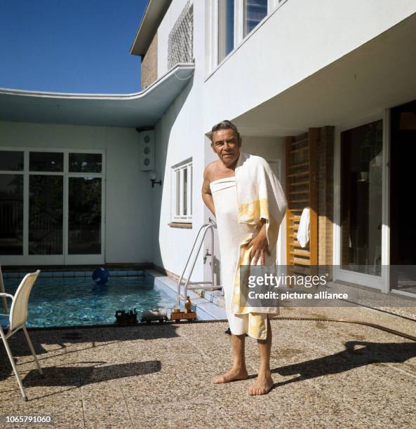 German singer, actor, and entertainer Peter Frankenfeld standing on the terrace of his house in Wedel, on 18th June 1970. | usage worldwide