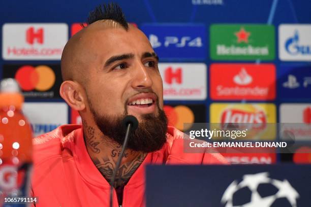 Barcelona's Chilean midfielder Arturo Vidal looks on during a press conference at the Philips stadium in Eindhoven on November 27, 2018 on the eve of...