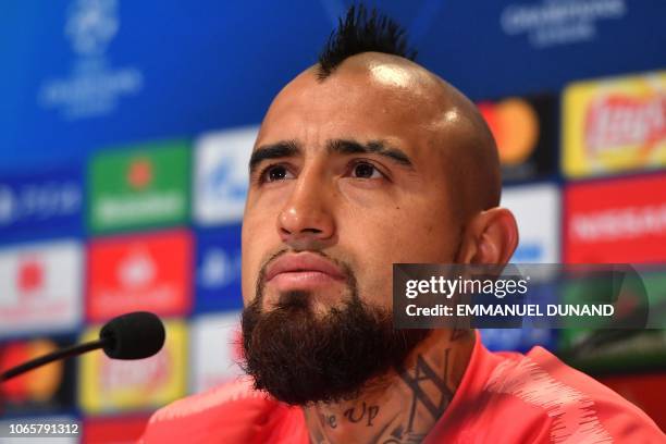 Barcelona's Chilean midfielder Arturo Vidal looks on during a press conference at the Philips stadium in Eindhoven on November 27, 2018 on the eve of...