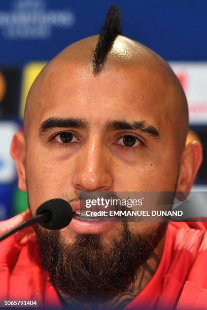 Barcelona's Chilean midfielder Arturo Vidal speaks during a press conference at the Philips stadium in Eindhoven on November 27, 2018 on the eve of...