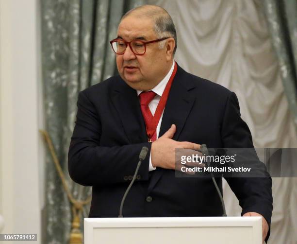Russian billionaire and businessman Alisher Usmanov speaks during the State Awards Ceremony at the Kremln in Moscow, November 2018. Putin is planning...