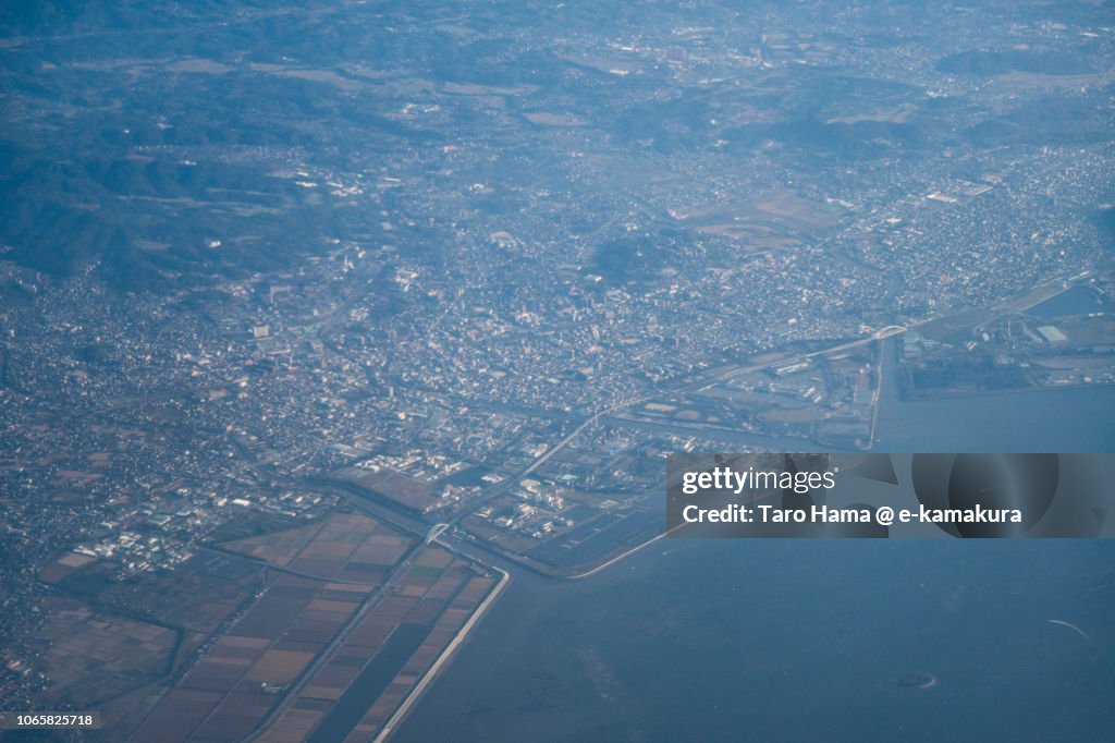 Ariake Sea and Omuta city in Fukuoka prefecture in Japan daytime aerial view from airplane