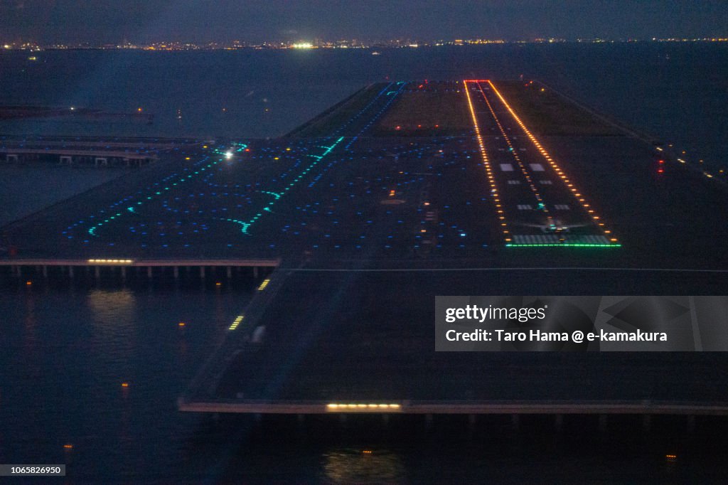"D" runaway of Tokyo Haneda International Airport night aerial view from airplane