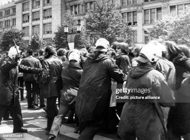 West Berlin policemen force back demonstrators, partly with the help of police batons, on the campus of the University of Technology in Berlin. After...