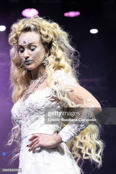 Model is seen during is seen during the 'FEDERICO FASHION STYLE - Angel & Devil' part of "On Hair Show & Exhibition" held at BolognaFiere Exhibition...