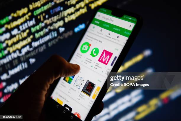 In this photo illustration, the Google Play Store app is seen displayed on an Android mobile phone.