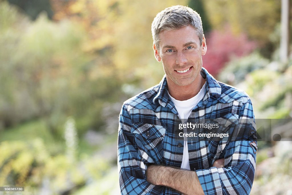 Man Standing Outside In Autumn Landscape