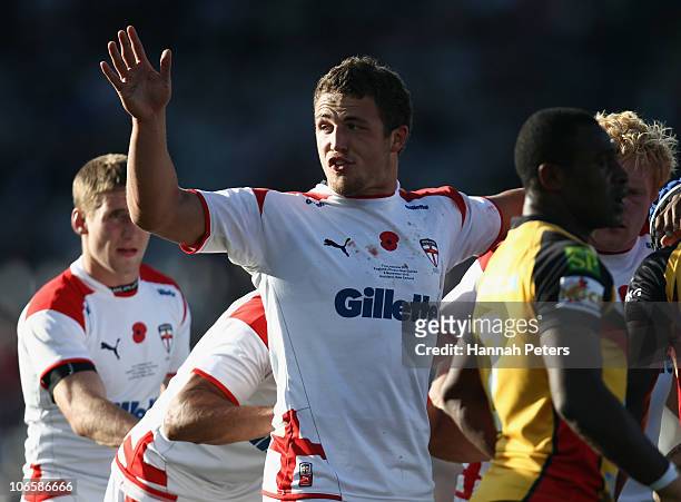 Sam Burgess of England calls for assistance during the Four Nations match between England and Papua New Guinea at Eden Park on November 6, 2010 in...