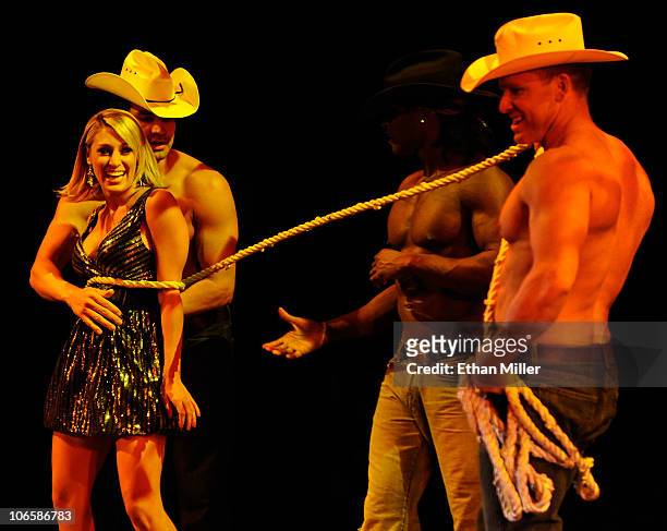 Television personality Vienna Girardi appears onstage with Chippendales dancers Juan DeAngelo, Chaun Thomas Williams and James WIlcox as Girardi...