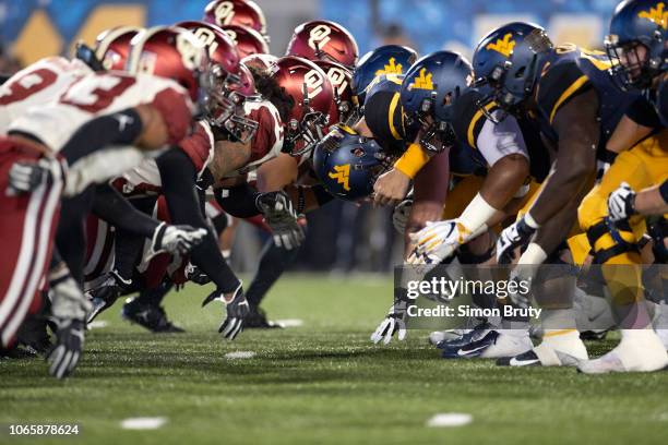 Oklahoma defensive line in action at line of scrimmage vs West Virginia offensive line at Mountaineer Field at Milan Puskar Stadium. Morgantown, WV...