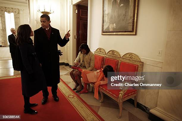 The exhausted First Family arrive back at their new home at 1600 Pennsylvania avenue after President Barack Obama was sworn in by Chief Justice John...