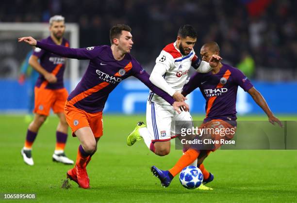 Nabil Fekir of Olympique Lyonnais takes on Fernandinho and Aymeric Laporte of Manchester City during the Group F match of the UEFA Champions League...