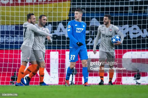 Ismaily of Donetsk celebrates his team's first goal with team mates Maycon and Junior Moraes during the UEFA Champions League Group F match between...