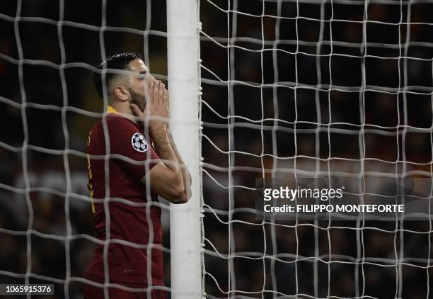 Roma Greek defender Konstantinos Manolas reacts after missing a goal during the UEFA Champions League group G football match AS Rome vs Real Madrid...