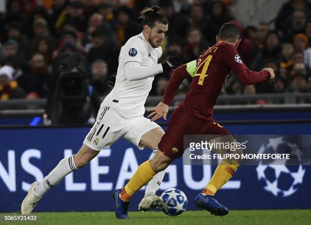 Real Madrid's Welsh forward Gareth Bale outruns AS Roma Greek defender Konstantinos Manolas during the UEFA Champions League group G football match...