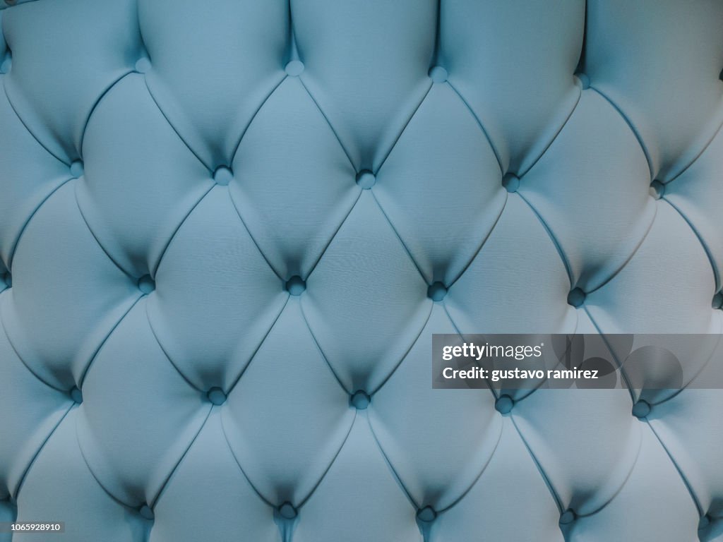 Teal blue capitone textile background