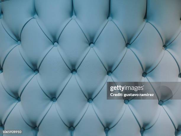 teal blue capitone textile background - golden pattern on walls fotografías e imágenes de stock