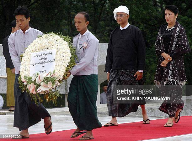 Aung San Oo , elder brother of Myanmese detained leader Aung San Suu Kyi, along with his wife Lei Lei Nwe Thein arrives to pay respect to their late...