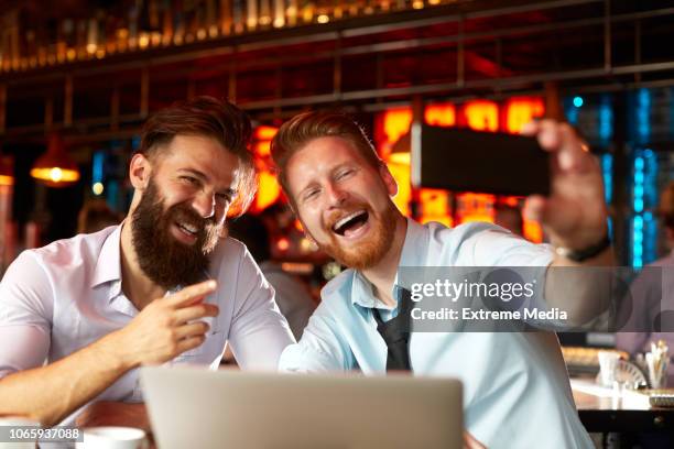 coworkers in a cafe bar posing for a selfie - virtual lunch stock pictures, royalty-free photos & images