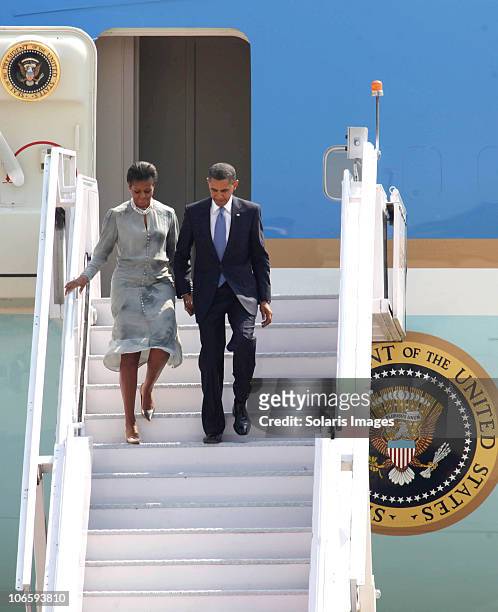 President Barack Obama and his wife First Lady Michelle Obama descend the steps of Air Force One as they disembark on arrival at Chhatrapati Shivaji...