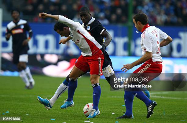 Piotr Trochowski of Hamburg and Demba Ba of Hoffenheim compete for the ball during the Bundesliga match between Hamburger SV and 1899 Hoffenheim at...
