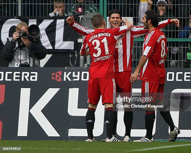 Mario Gomez celebrates the first goal with Hamit Altintop and Bastian Schweinsteiger during the Bundesliga match between Borussia Moenchengladbach...