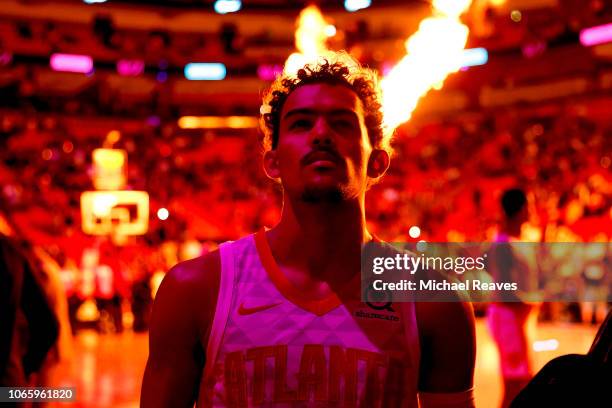 Trae Young of the Atlanta Hawks looks on during pregame introductions against the Miami Heat at American Airlines Arena on November 27, 2018 in...