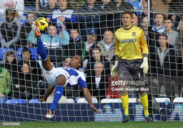 Cameron Jerome of Birmingham attempts an overhead kick at goal with Robert Green of West Ham looking on during the Barclays Premier League match...