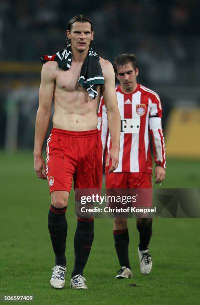 Daniel van Buyten of Bayern and Philipp Lahm look dejected after the 3-3 draw of the Bundesliga match between Borussia Moenchengladbach and FC Bayern...