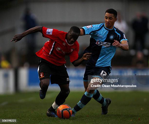 Andy Yiadom of Hayes & Yeading battles with Lewis Montrose of Wycombe during the Hayes and Yeading United FC and Wycombe Wanderers FA Cup 1st Round...