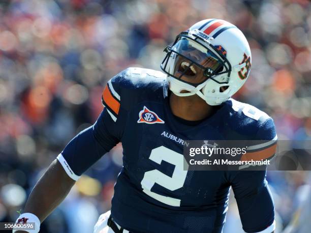 Quarterback Cam Newton of the Auburn Tigers celebrates a touchdown against the Chattanooga Mocs November 6, 2010 at Jordan-Hare Stadium in Auburn,...