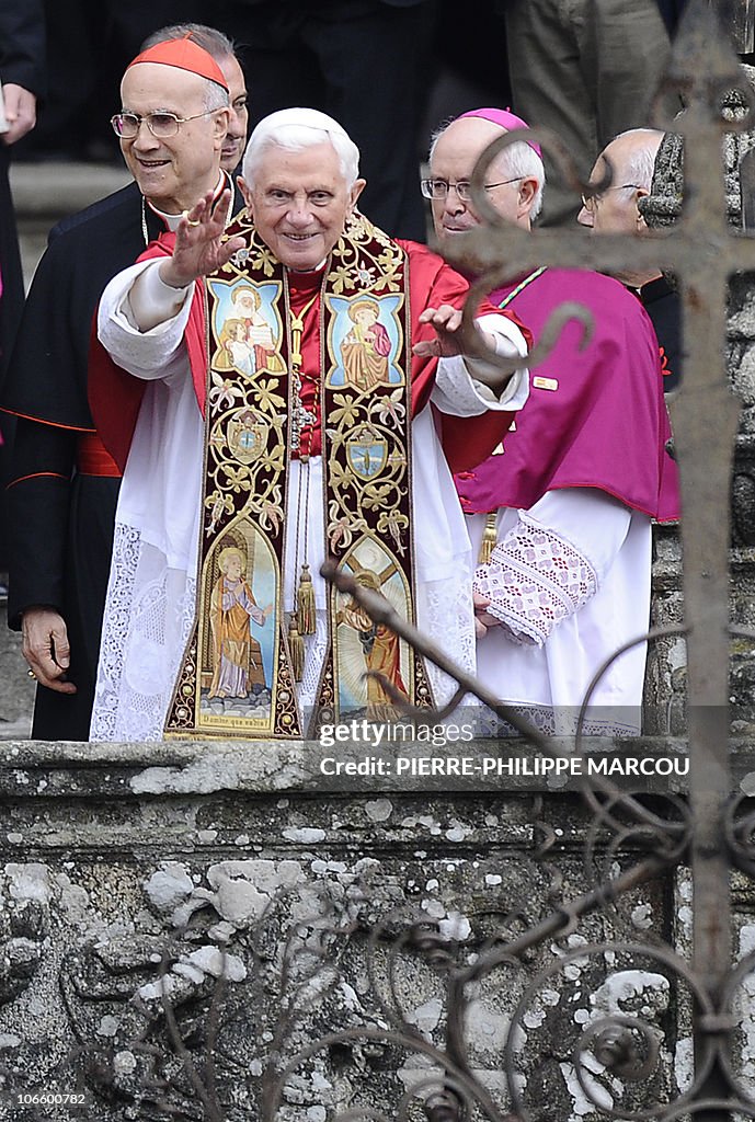Pope Benedict XVI (C) blesses faithful f